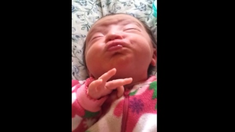 Newborn baby makes adorable facial expressions