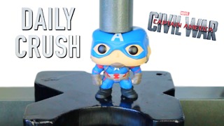 Crushing Captain America vinyl action figure with hydraulic press