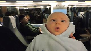 Baby Boy Makes Funny Faces On Train Ride