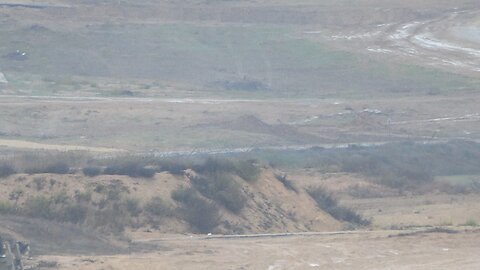 Israeli army vehicles manoeuvring on the Israel-Gaza border