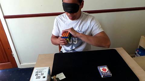 Guy solves Rubik's cube blindfolded using magic