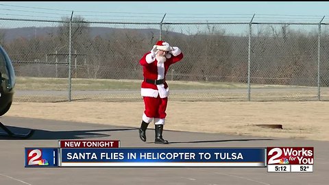 Santa leaves sleigh at North Pole and arrives in helicopter at Tulsa's Air and Space Museum