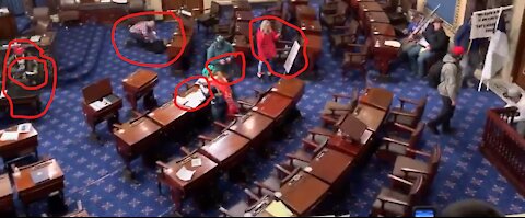 Group Inside Chambers Taking Pictures of Documents