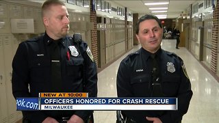 Body cameras catch Milwaukee Police officers rescuing mom and toddler from crash