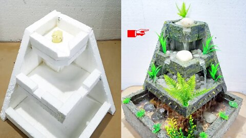 Homemade Styrofoam and cement mini water fountain waterfall