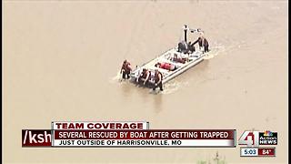 Many people rescued by boat after flooding