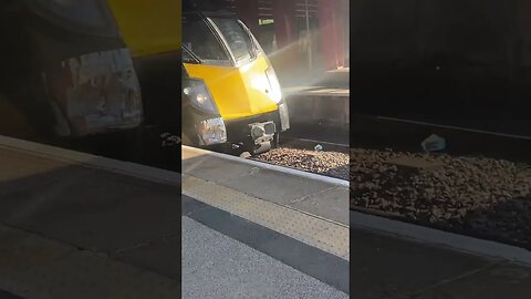 Northern railway train and grand central train at Bradford interchange going to Halifax