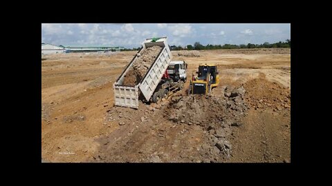 Bulldozer and Dump Truck Spreading