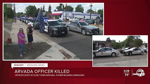 Police vehicles from across Colorado arrive for procession for fallen Arvada officer