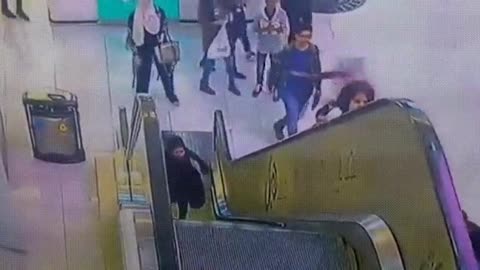 Girl Stuck on Escalator Gets Saved.