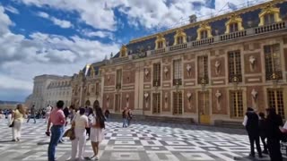 Part of the roof of the palace, where repairs were underway, is on fire.