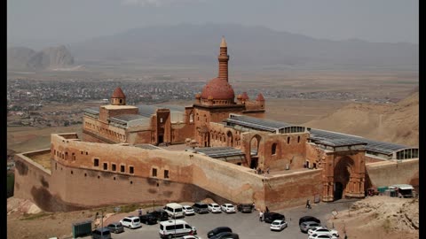 Panoramic view of Ishak Pasa Sarayi Palace with mountains, Turkey.