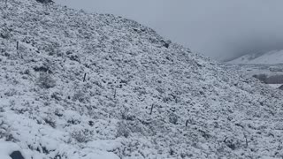 Hiking in a cold and snowy weather .