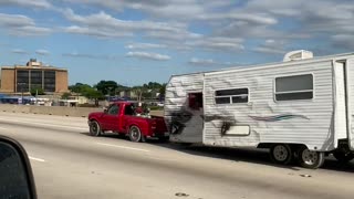 Small Truck Tows Long Trailer