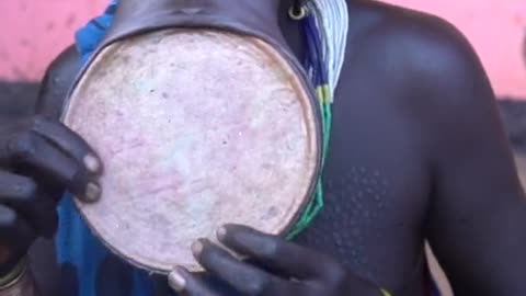 A woman from the Surma tribe puts in her lip plate #afric...