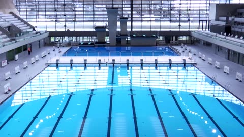 France's Macron inaugurates Olympic Aquatics Centre