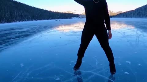 elladjbalde creates art as he skates on Lake Louise in Banff National Park