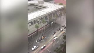 Pedestrian swims in flooded Fort Lauderdale street