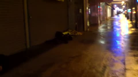 Homeless napping outside on a Los Angeles Rainy day
