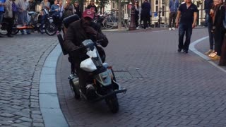 Riding a Scooter on Two Wheels