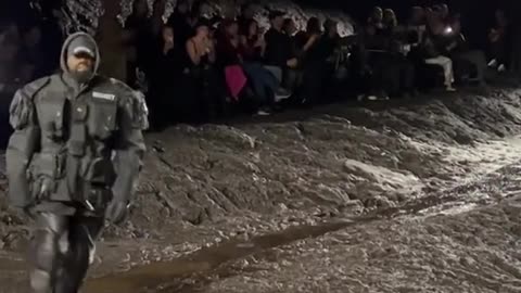 Kanye West walking through mud for Balenciaga in Paris