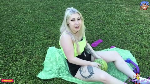 Beautiful Girl Crushing Watermelon with thigh