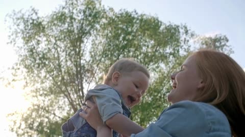 The Joyful Bond: A Happy Baby and Her Loving Mother