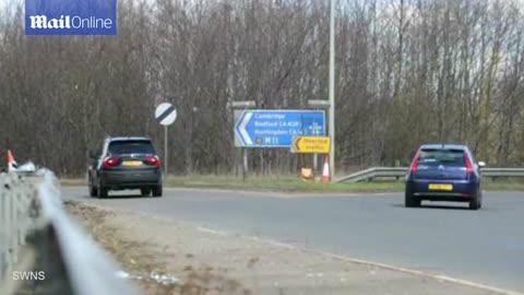 Shocking moment string of cars reverse up motorway slip road