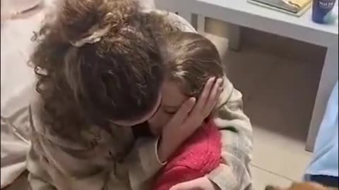 Sweet moment Emily Hand is reunited with her big sister and two dogs
