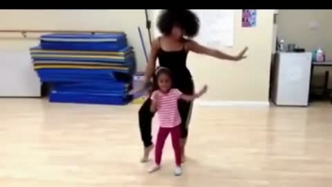 Little Girl Dancing Like Her Mother.