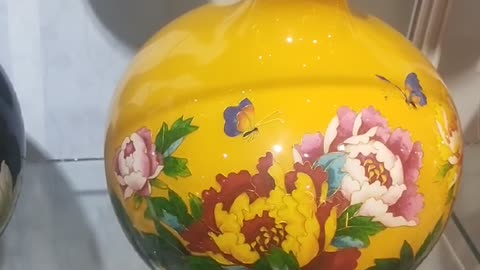Peony flowers and butterflies on porcelain