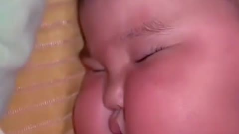 How beautiful and cute baby is sleeping