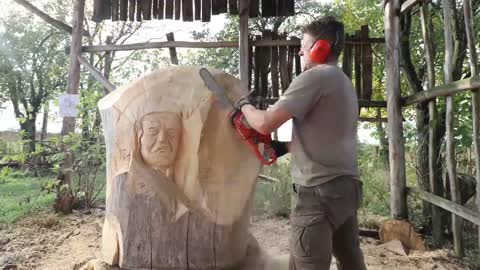 AMAZING CHAINSAW wood carving, Native American with wolves