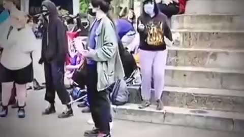 THIS WAR VETERAN WALKS THROUGH A CROWD LOOKING BACK REMEMBERING HOW HE SERVED FOR OUR COUNTRY TO WITNESS SUCH UNRULINESS