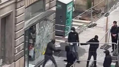 Barbarian horde loots a Catholic bookshop in Nantes.