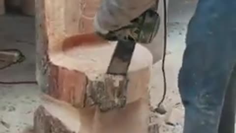 Boy carving a wooden piece into a chair!!!