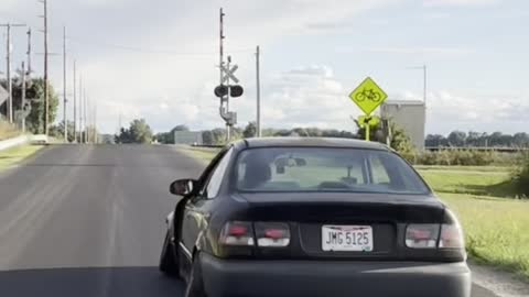 Stanced Honda Civic EK Coupe Jumps Tracks