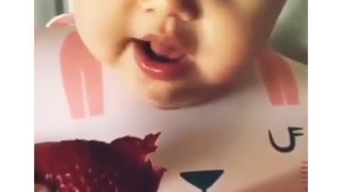 Cute baby eating Strawberry for the first time!