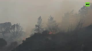 Sky filled with smoke as wildfires continue to rage on Greek island