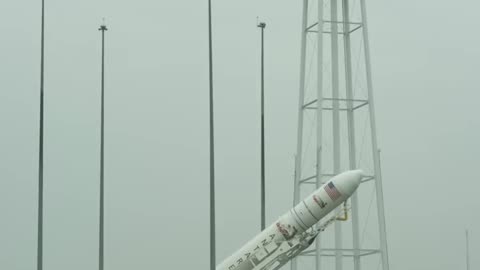 NASA Antares rocket raised on launch pad