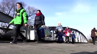 Fleeing war, people cross into Romania from Ukraine