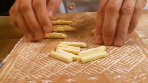 Chef demonstrates how to create designs on pasta