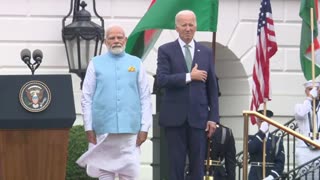 Biden raises his hand to his heart for the national anthem ... of India.