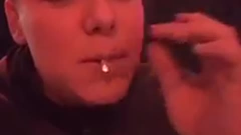 Man Messing Around Inhales a Cigarette