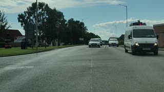 Emergency Ambulance at traffic lights in Scotland