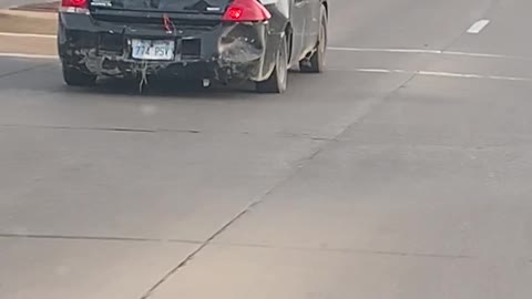 Car Driving With a Huge Fan on the Roof