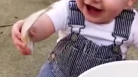 baby likes to play with live fish