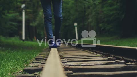 Close Up Of The Female Legs Walking On The Railway