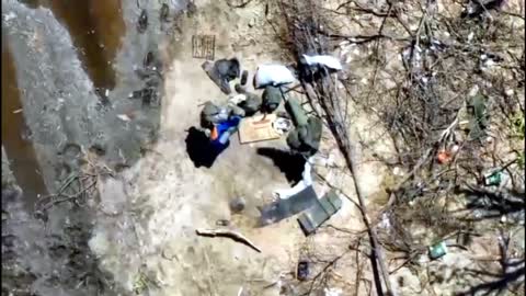 Ukrainian drone drops a modified VOG grenade on a Russian soldier walking to his foxhole
