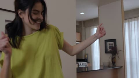 Girl dancing happy at home
